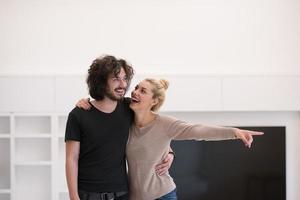 couple hugging in their new home photo