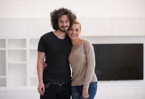 couple hugging in their new home photo