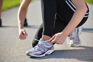 Young beautiful  woman jogging at morning in park photo