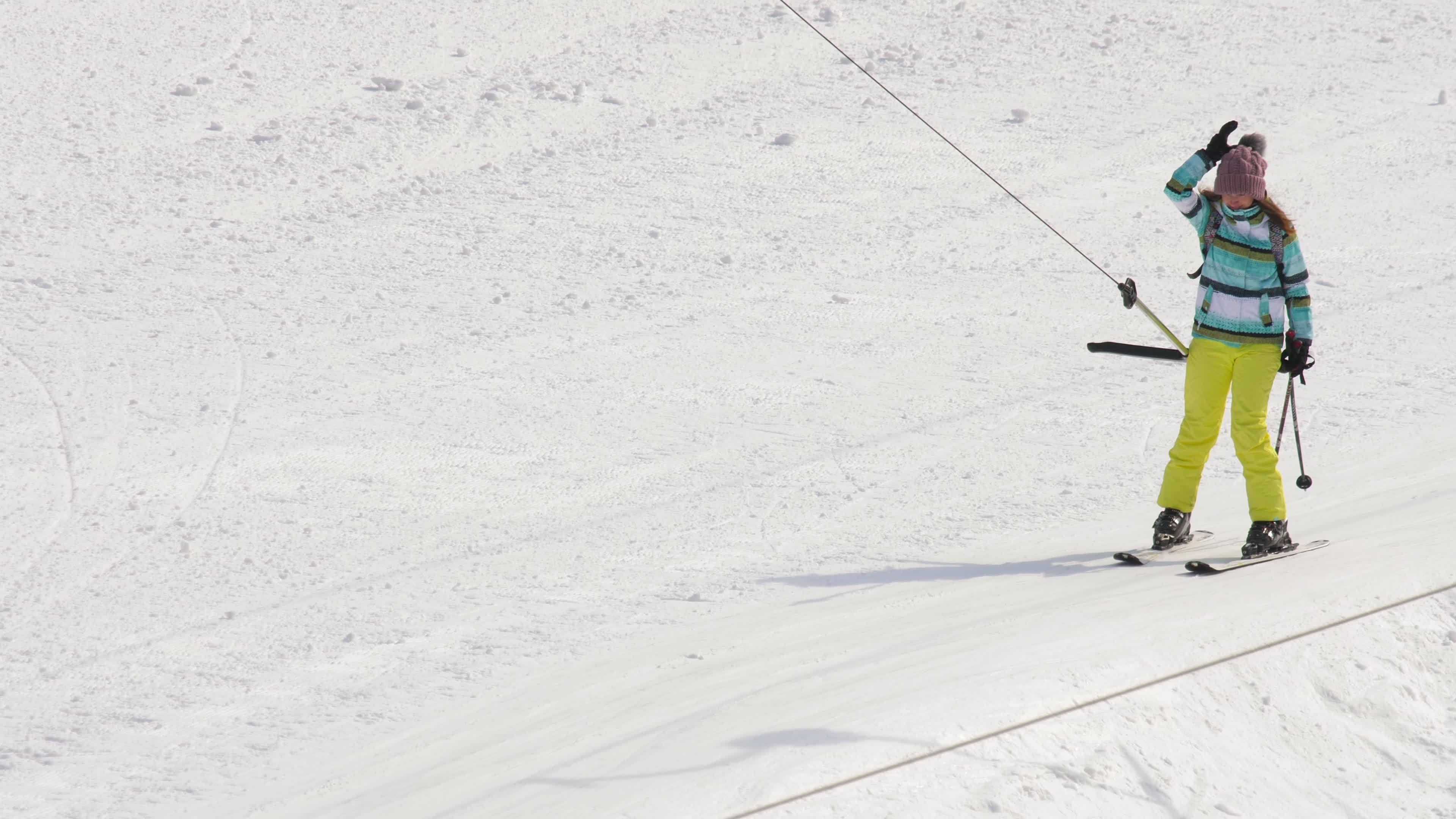 Amateur skier girl on a lift photo