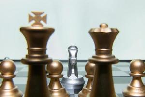 gold and silver chess on board close up image abstract Background. photo