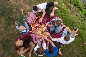 top view of group friends enjoying picnic time photo