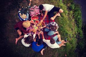 top view of group friends enjoying picnic time photo