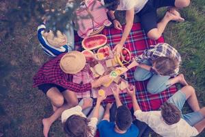 top view of group friends enjoying picnic time photo