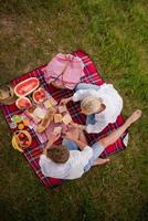 top view of couple enjoying picnic time photo