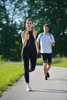 Young couple jogging at morning photo