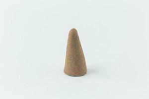 Incense Cone in a stand with the feather for background. photo