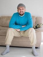 happy young  man  relaxing at home photo