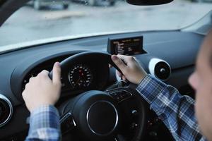 man using car navigation photo