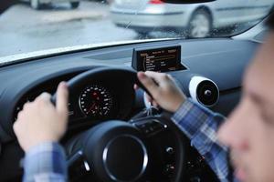 man using car navigation photo