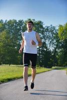 Young couple jogging at morning photo