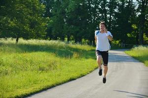 Young couple jogging at morning photo