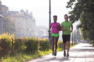 young multiethnic couple jogging in the city photo