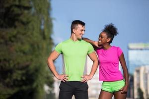 portrait of young multietnic jogging couple ready to run photo