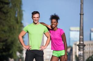 portrait of young multietnic jogging couple ready to run photo