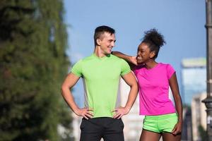 portrait of young multietnic jogging couple ready to run photo