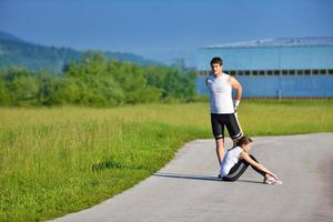 people doing stretching exercise  after jogging photo