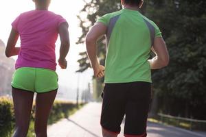 young multiethnic couple jogging in the city photo