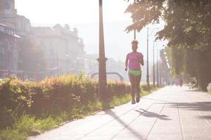 african american woman jogging in the city photo