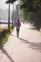 african american woman jogging in the city photo