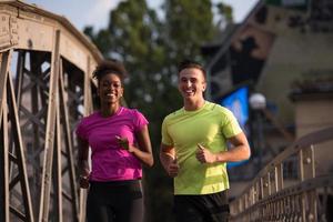 multiethnic couple jogging in the city photo