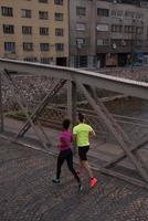 young multiethnic couple jogging in the city photo