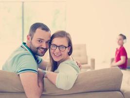 family with little boy enjoys in the modern living room photo