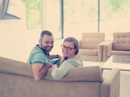 Rear view of couple watching television photo