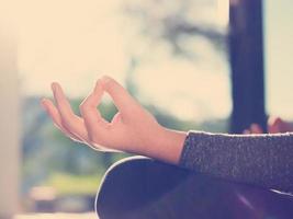 young woman doing morning yoga exercises photo