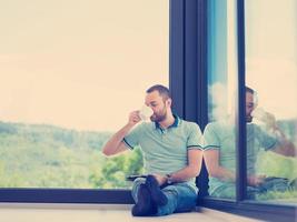 man on the floor enjoying relaxing lifestyle photo