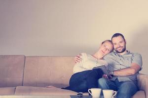 romantic couple relaxing at  home with tablet computers photo