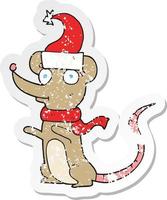 retro distressed sticker of a cartoon mouse wearing christmas hat vector