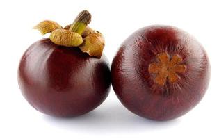 Two ripe mangosteen isolated on a white background. photo