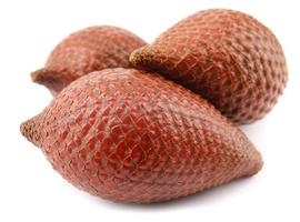 Fresh snake fruit is isolated on a white background.Red Salacca. Salak fruit. Salacca zalacca, Snake fruit . photo