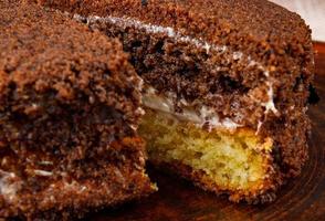 tiramisu cake is cut in half. photo