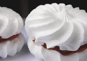 Two snow-white meringues. Beautiful white cake. photo