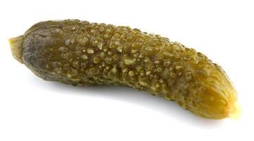 Crispy pickled cucumber is isolated on a white background. photo