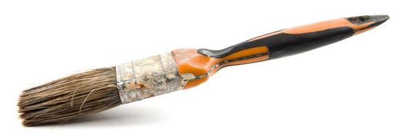 The old painting brush is isolated on a white background. photo