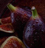 Figs are whole and cut into pieces. ripe figs. photo