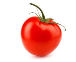 The ripe red tomato is isolated on a white background. Full clipping path. photo