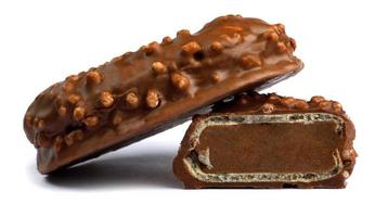 Sweets with crisp waffles in chocolate are isolated on a white background. photo