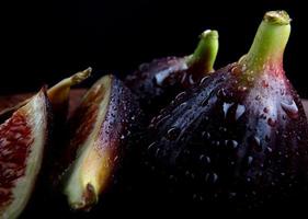 Whole and cut into pieces of figs. photo