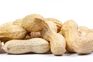 Peanuts in shell and on a white background. photo