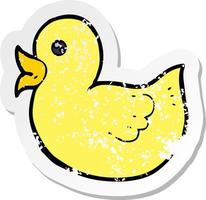 retro distressed sticker of a cartoon rubber duck vector