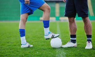 football players in competition for the ball photo