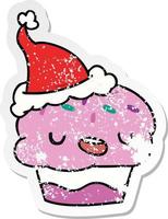 christmas distressed sticker cartoon of kawaii cupcake vector