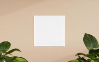 Clean and minimalist front view square white photo or poster frame mockup hanging on the wall with blurry plant. 3d rendering.