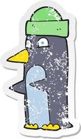 retro distressed sticker of a cartoon penguin wearing hat vector