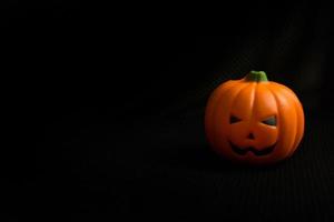 The halloween pumpkin jack in black holiday background image. photo