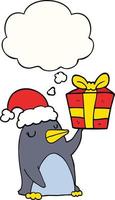 cartoon penguin with christmas present and thought bubble vector